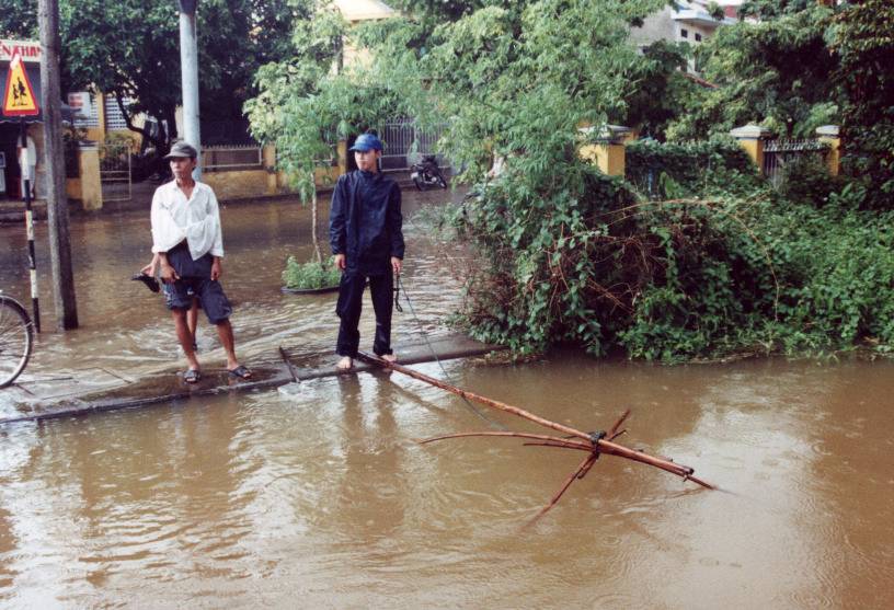 These guys are fishing with the typical nets in a stormwater drain.