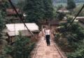 A rickety bridge across a big river to an ethnic minority village.