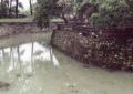 Fishing in the moat of a temple.